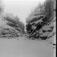 Kort: Nord-Fron. 16.09.1909. Islagt  Vinstraelv sett ovenfra, tømmer, vinterlandskap.