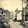 Postkort. Jule- og nyttårshilsen. Fotografisk motiv. Svart/hvitt. Fra Bjørneveien, Kragerø. Hus. Stemplet 23. 12. 1905.