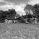 Sælid, Hamar, Hedmark. Hovedbygningen med keglebanehus, sett fra et jorde med traktor. 
Fra dr. Eivind S. Engelstads storgårdsundersøkelser 1955.