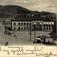 Postkort. Jule- og nyttårshilsen. Motiv fra Drammen. Bygate. Jernbanestasjonen. Bragernesåsen i bakgrunnen. Stemplet 24.12.1903.