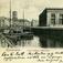 Postkort. Nyttårshilsen. Fotografisk motiv.  Svart/hvitt. Fra Kjøbenhavn:  Thorvaldsens Museum. Bybebyggelse. Gater. Kanal. Båter. Fotgjengere. Stemplet 27.12.1902.(?)