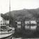 Havneområde med trehus og seilbåter, Kleven, Mandal, Vest-Agder. Fotografert 1923.