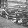 Sliping av ljå på slipestein drevet med vannkraft, Vognill, Oppdal, Sør-Trøndelag. Fotografert 1936.