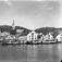Molde i panorama sett fra Sør ,  Molde med havna like utenfor torget..Fiskehandler A.Simonsen med sønner ses  nederst på toget..S.Nyland jernvare forretning til høyre.