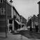 Storgata sett østover. ,  Storgata sett østover fra S.Pettersson mot Torget.S.Pettersson til høyre..H.George Dahl til venstre..Bennets reisebeureau til venstre..Fotograf A.Groven til høyre.