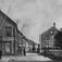 Til Høyre: Otvell ? Linds gård. Ca 1905. St.Sunniva-katolsk kirke i 1. Etasje, Bildet tatt østover Storgata. ca 1905. Til venstre Ludvig Sættem og posten.